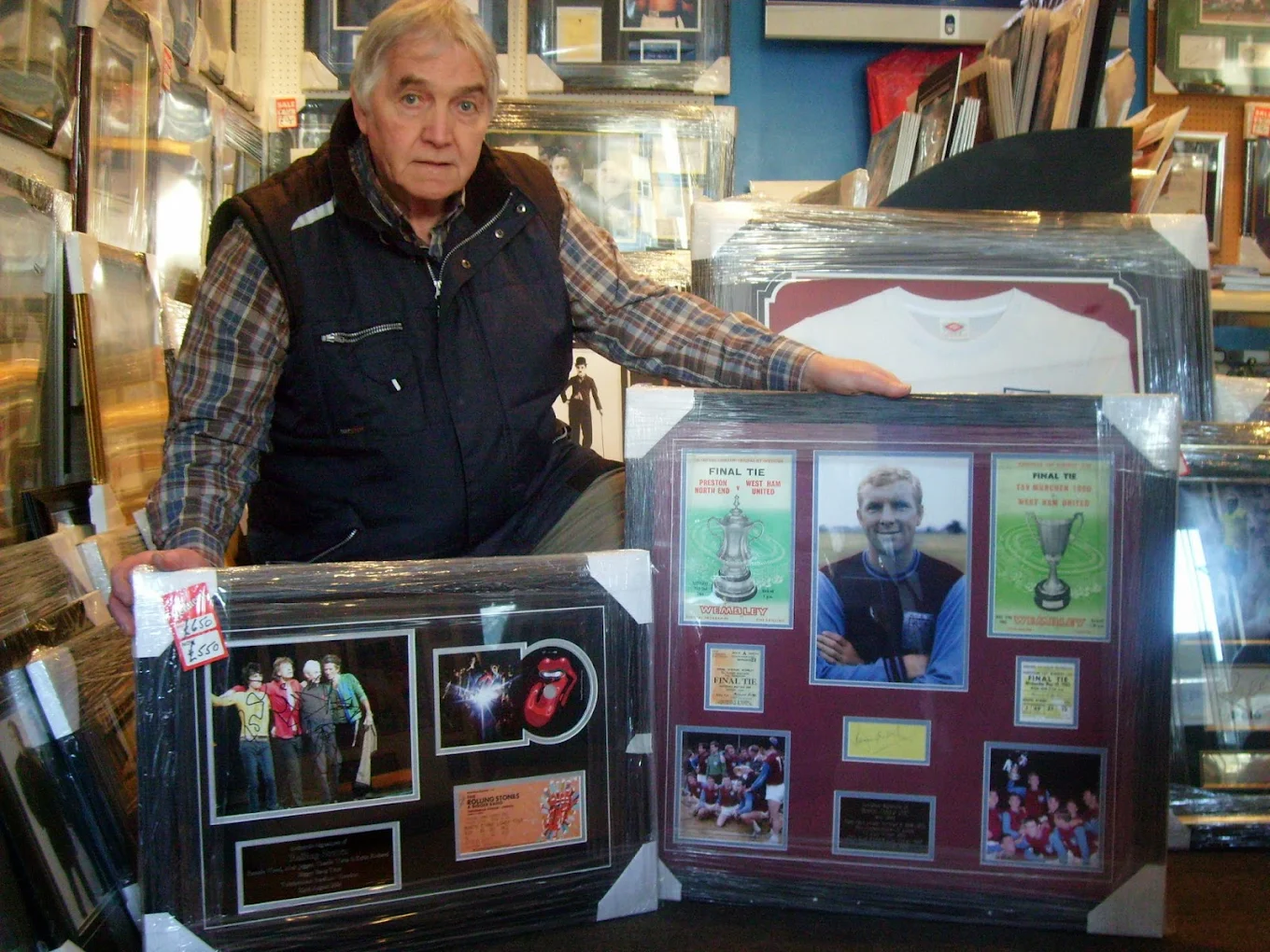 Owner displaying signed memorabilia